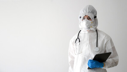 Doctors in PPE protective clothing to screen for COVID-19, COVID-19 infection