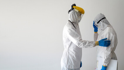 COVID-19 infection, Doctors in PPE protective clothing mourn the outbreak. Infection with COVID-19