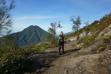 Fototapeta na wymiar A Woman On The Way Down From Mount Ijen Banyuwangi Indonesia.