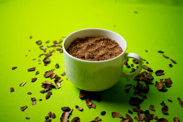cocoa inside a white cup with green background