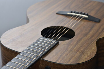 Fototapeta premium Acoustic guitar close-up on a beautiful colored background, the concept of stringed instruments