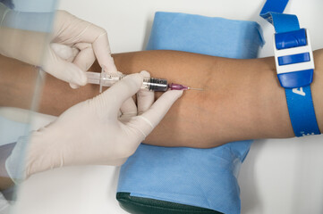 Close up nurse hand collecting blood sample for diagnosis covid-19, Coronavirus.Laboratory...
