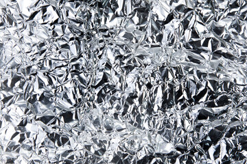 background of silvery aluminum crumpled foil