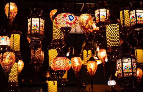 Colorful lamp on celebration festival.Arabic lamp lighting with colors on muslim lantern shining in the cafe and restaurant.
