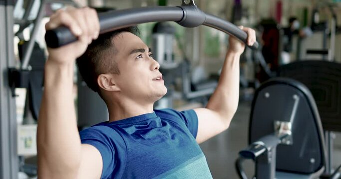 Active young man working exercise in the gym