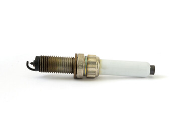 Black oily deposits on the electrodes and insulator tip points to an oil-fouled plug on spark plug with copy space on white background.