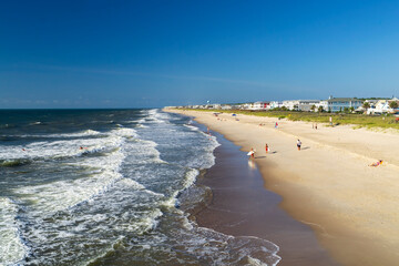 Guys on the beach ready to start surfing