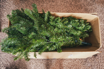 Boxed artificial Christmas tree before or after seasonal setup for holidays