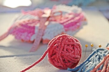 Pink cotton rope for knitting macrame in role on the pad