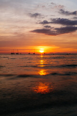 Fototapeta na wymiar sunset over the sea with boats 
