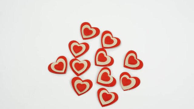 small red hearts on a white background copy the space. Valentine's Day concept for design