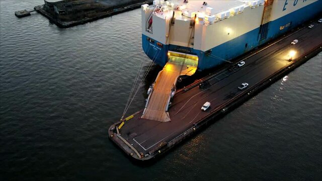 Aerial Timelapse of Vehicle Carrier Unloading Cars at Port

