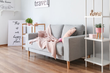 Stylish interior of room with sofa
