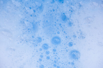 Abstract background white soapy foam texture. Shampoo foam with bubbles