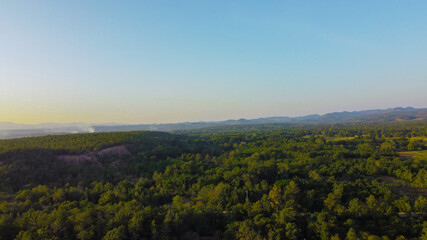 Obraz premium Aerial view of mountains with green forest.