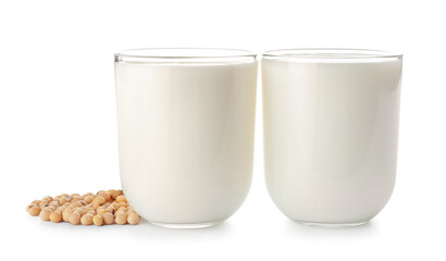 Glasses of soy milk on white background