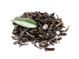 Heap of dry black tea leaves on white background