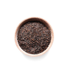 Bowl with dry black tea leaves on white background