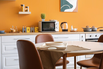 Interior of modern kitchen with dining table