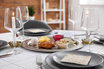 Passover Seder plate with traditional food on served table