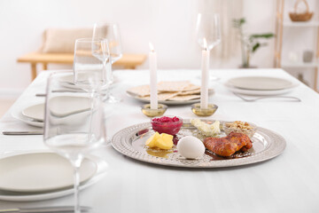 Passover Seder plate with traditional food on served table