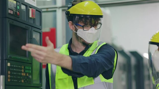 Group Machine engineer wear mask and face shield while working in  industrial plant. Safety in work to prevent COVID-19 and Dust PM2.5. Inspection service with modern technology With professional team
