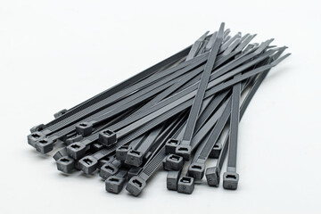 Grey plastic cable ties isolated on a white background