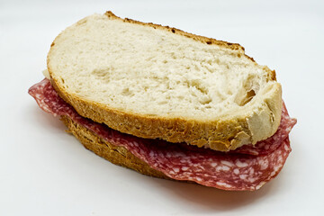 Salami sandwich, panino al salame, isolated on white background