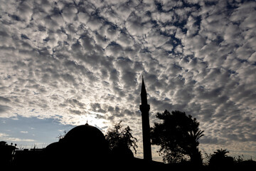 old mosque and cloudy sky