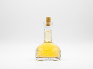 Glass carafe with alcohol drink closed with cork cap isolated on a white background. Transparent...
