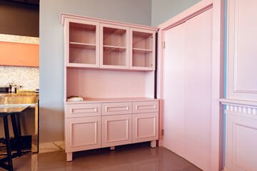 Empty pink wooden cupboard in cafe interior