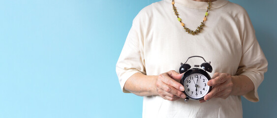 Senior generation with an alarm clock. Elderly time, utilization of time, lifestyle, time left,...