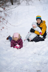 Three children on a walk in winter, a teenager