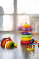 Toys are scattered on the floor