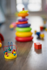 Toys are scattered on the floor