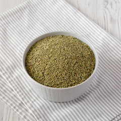 Organic Dried Rosemary in a Bowl, low angle view. Close-up.