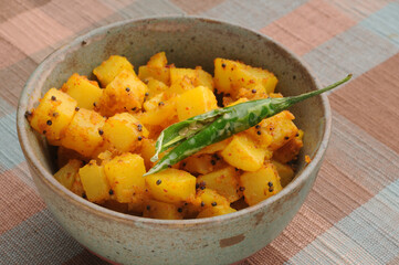 potato curry with fried green chilly