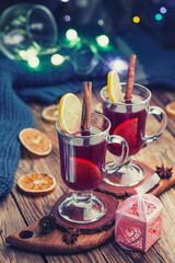 Mulled wine with cinnamon sticks and orange