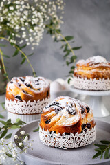 Easter cake kraffin. Craffins with raisins, candied fruits and sprinkled with powdered sugar. Close-up of homemade pie. Cruffin.