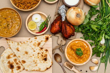 Various indian food menus, biryani rice, butter chicken, tandoori, bean curry and naan bread
