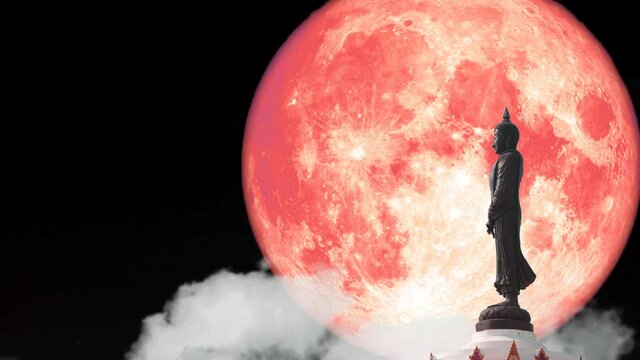 Super full red moon and Buddha looking seven day style on the night sky and white cloud time lapse, Makha Bucha Day is held full moon day on february or march