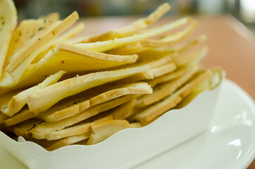 crispy bread butter with garlic on white plate