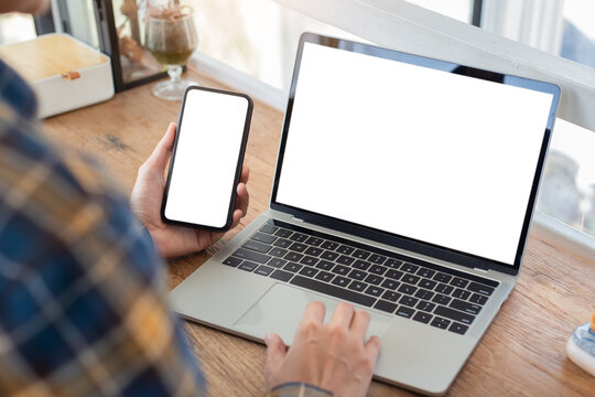 Computer Screen,cell Phone Blank Mockup.hand Woman Work Using Laptop Texting Mobile.with White Background For Advertising,contact Business Search Information On Desk In Cafe.marketing,design