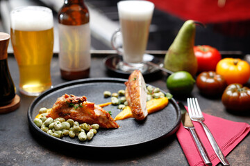 Roasted poultry fillet with broad beans and carrot puree ..
Food served on a plate, food styling, serving suggestions, culinary photography.