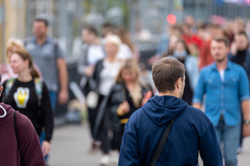 Crowd of people on the street. Summer day