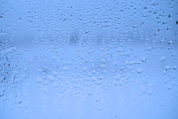 Abstract blue background. Sweaty glass texture. Macro.