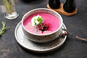 Beetroot soup with cream and chives.
Food served on a plate, food styling, serving suggestions, culinary photography