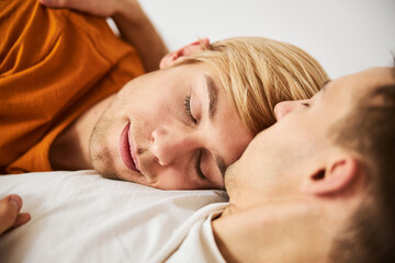 Fototapeta na wymiar Beautiful homosexual couple sleeping together at home
