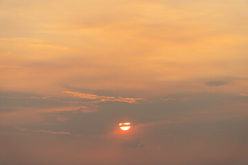 Beautiful pastel sky with golden clouds pattern in a holiday evening for background or wallpaper. Sunset sky. Twilight scene.