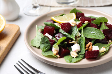 Delicious beet salad served on grey table, closeup